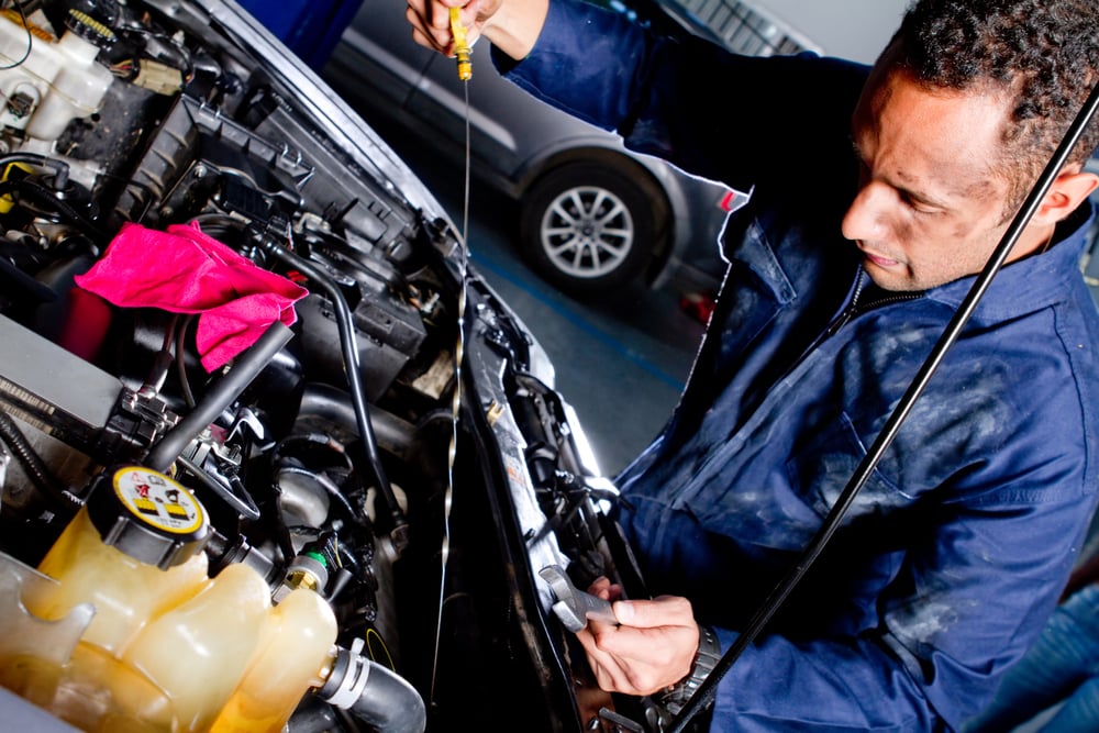 Mechanic fixing a car at the garage-1